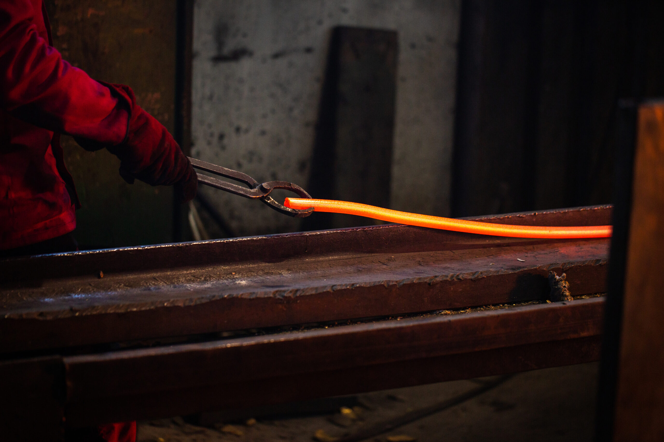 a person working with melted steel